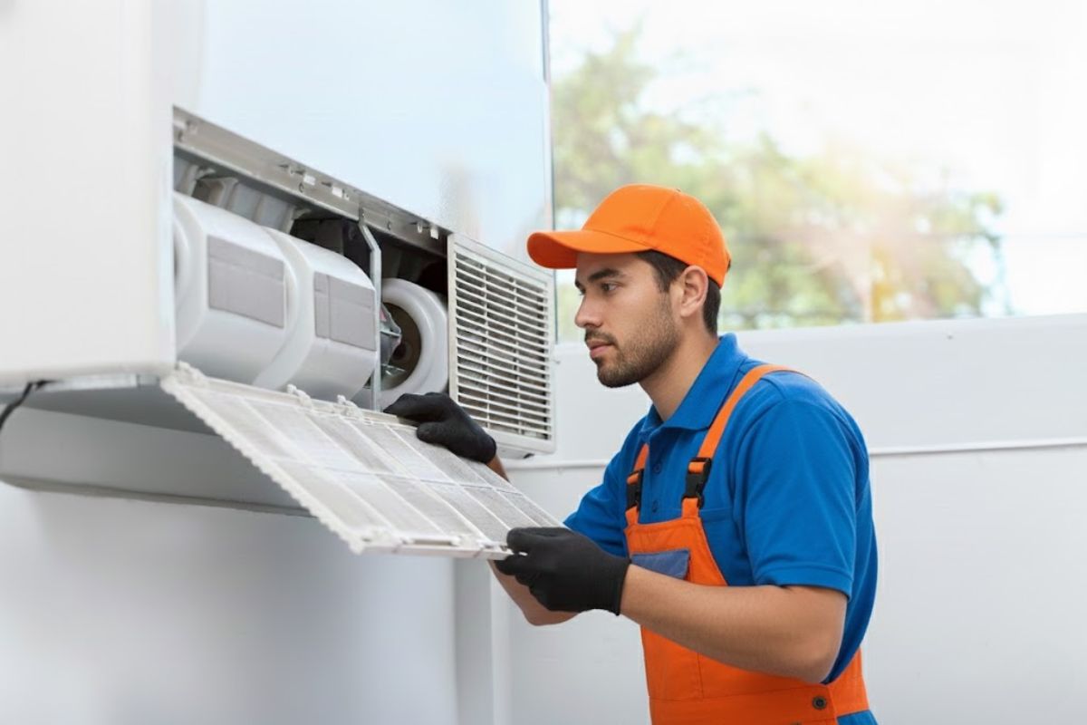 Discount AC technician inspecting a commercial walk-in cooler compressor and condenser coils in Arizona.