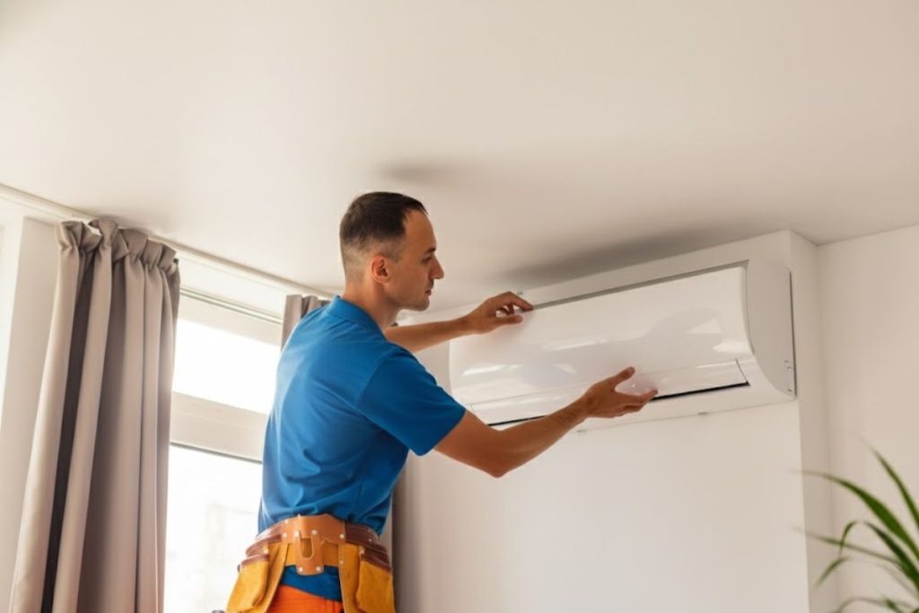 Discount AC technician performing a ductless mini split installation in an Arizona home addition.